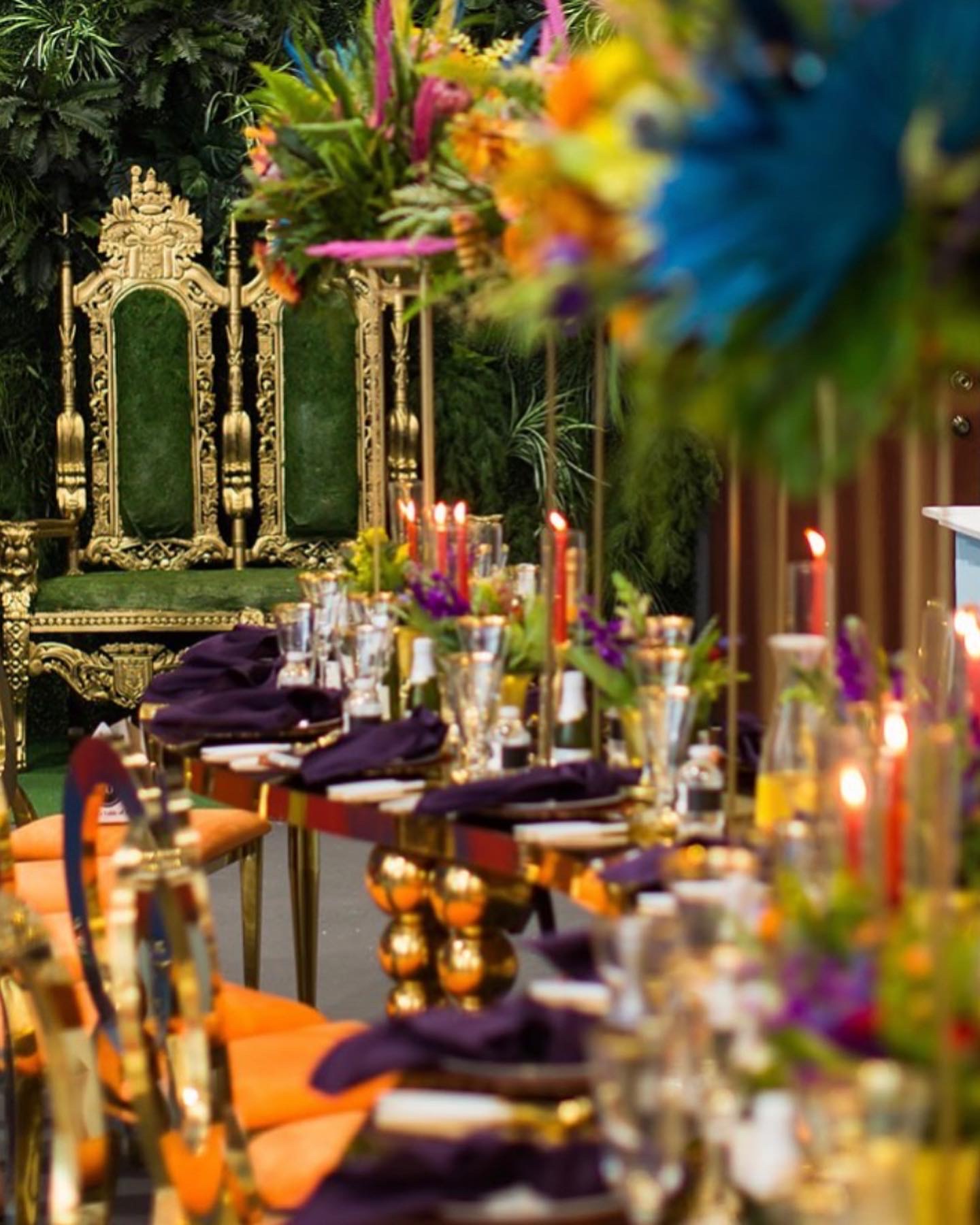 An opulent colorful tablescape with ornate seating