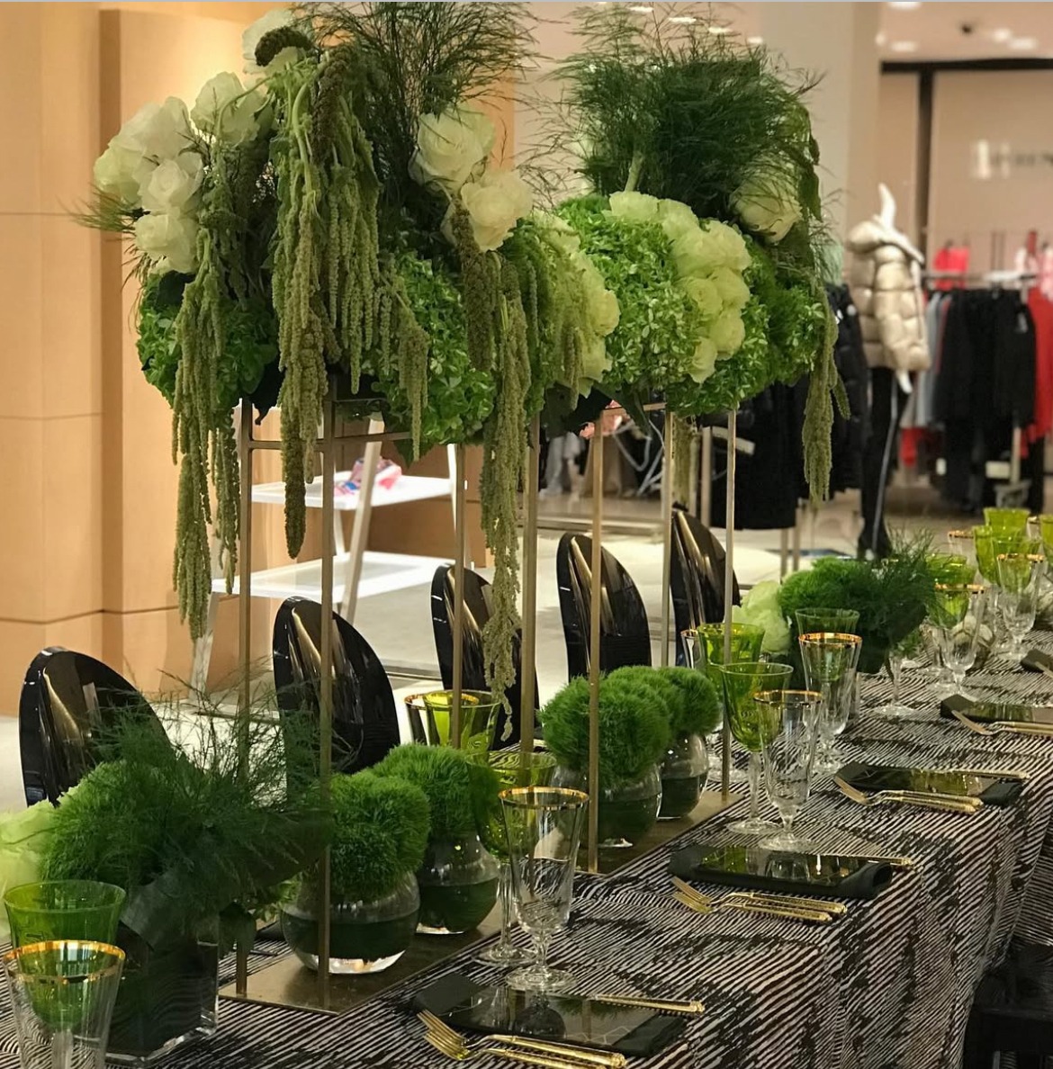 A sculptural green and white floral table designed for an intimate gathering